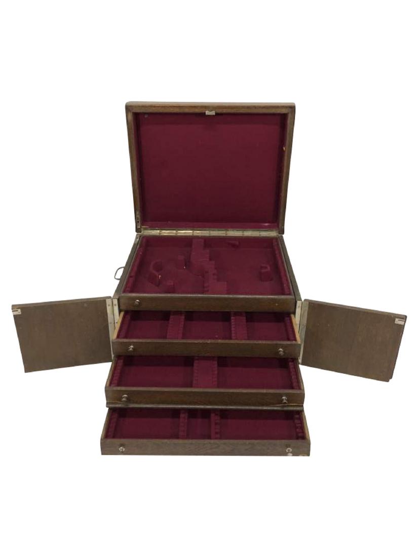 Four Drawer Silverware Chest: A four drawer silverware chest with hinged fronts that lock at the bottoms and a hinged top. A single key locks the full chest. 21.5"x18"x13.5"
