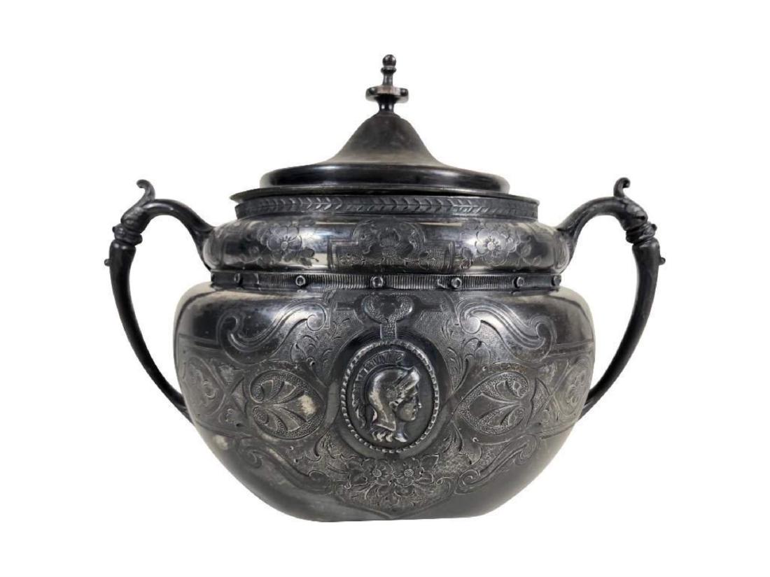 1870 Renaissance Victorian Spartan Bust Kettle: Bust of Spartan on the front, an exceptional and unique silver plate piece by "J. F. Curran & Co., New York". Measures 12" x 8" x 9".