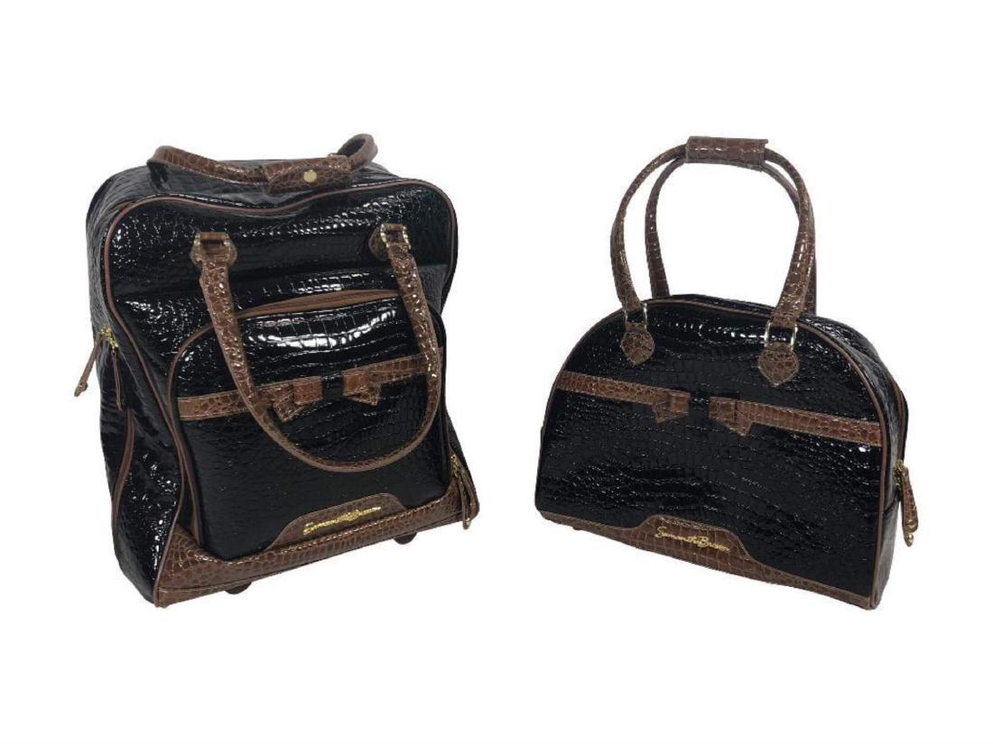 2 Samantha Brown Alligator-Leather Travel Bags: 2 bags from the same collection. One is backpack style with small wheels and extension arm pull. The other is an arm tote. Black with warm brown edging. Items measure 18" x 10" x 19" & 18" x 8" x 