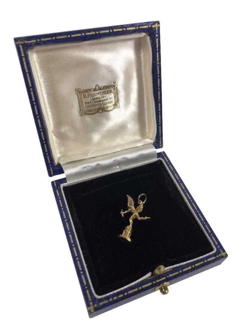 10K Gold Cupid Charm: A depiction of cupid or an angel with a bow and arrow. Hallmarked London. Purchased from Feinmesser Jewelers of London, UK. Item measures 1".