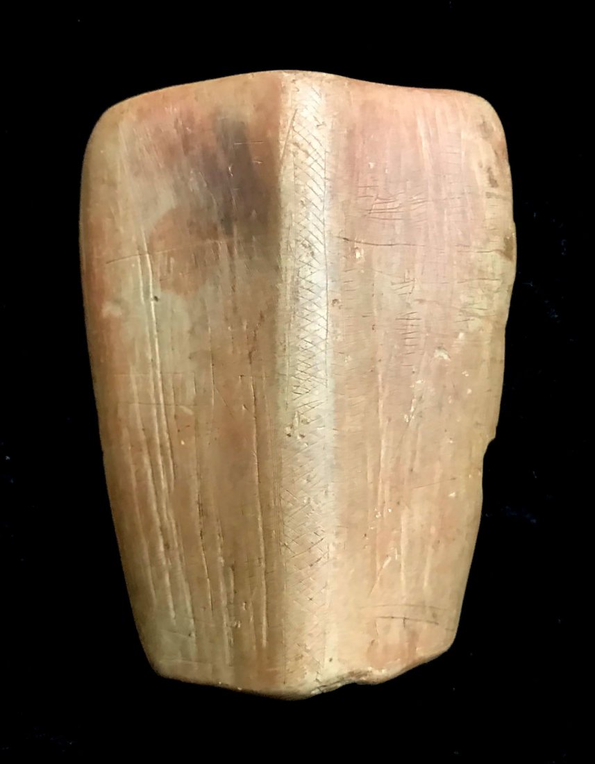 3 1/4" Shield Bannerstone. PA. Heavily engraved.: 3 1/4" Shield Bannerstone. PA. Heavily engraved. Tan, slate like material. Some modern grinding on bottom edge. Ex-John Berner. 3.29.19 added additional photos