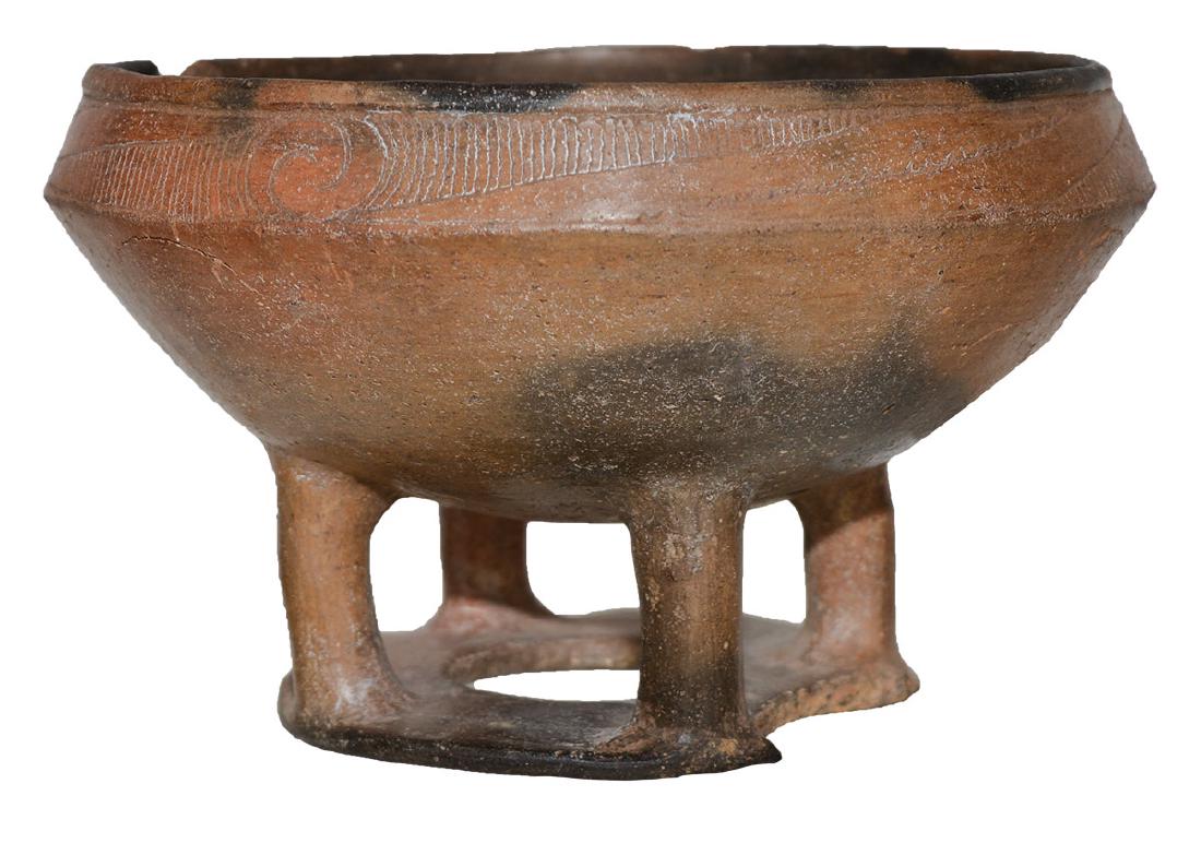 6 1/4" D. Caddo Pedestal Bowl. Pictured in Art of the: 6 1/4" D. Caddo Pedestal Bowl. Pike Co, AR. Finely engraved bowl, Rare, elevated with 4 legs on a pedestal ring. Some pressure cracking and a chip to ring, but in very fine condition. Pictured half pa
