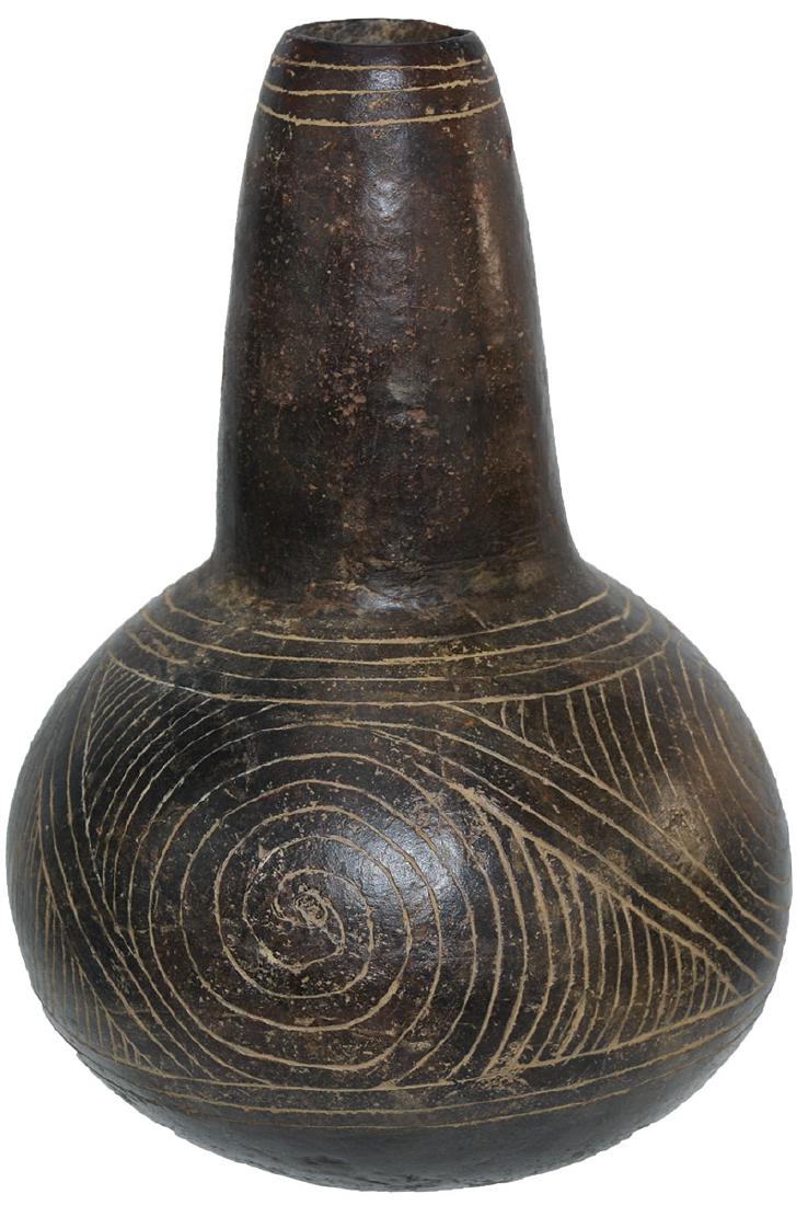 8 1/4" H. Engraved Caddo Bottle. Crenshaw. FB Glen: 8 1/4" H. Engraved Caddo Bottle. Crenshaw. Miller Co, AR. Finely engraved. Excellent balance. Graceful with narrowing stem. Ex-Ken Partain. FB Glen Kizzia. Featured on the back cover of this auction c