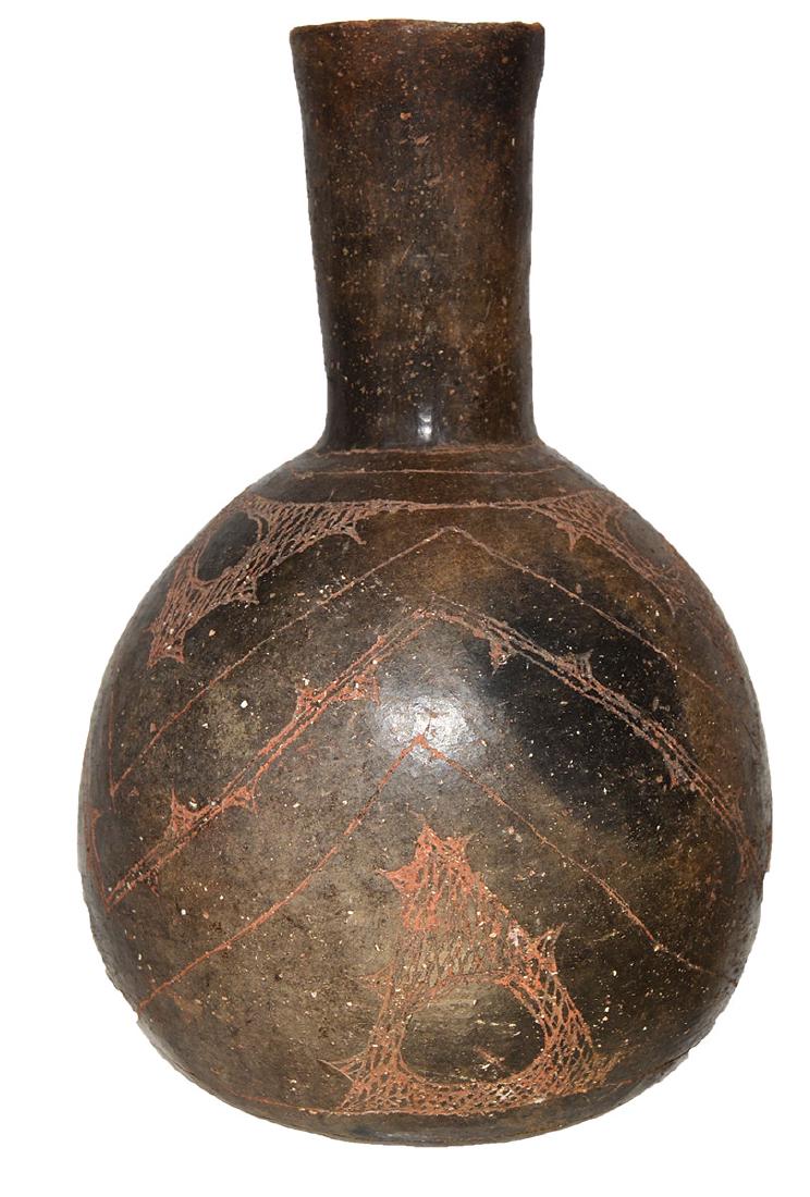 8 1/8" Caddo Engraved Waterbottle. Pictured in Art of: 8 1/8" Caddo Engraved Waterbottle. AR. Finely made Caddo masterpiece in very good condition. Minor repair. Finely engraved. Pictured in Art of the Ancient Caddo (p321). Ex-Jack Bonds
