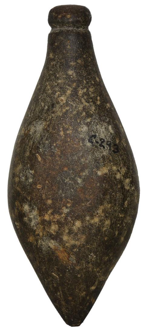 3 7/8" Grooved Plummet. Brown Co, OH. Ex- Bob: 3 7/8" Grooved Plummet. Brown Co, OH. Brown hardstone with good polish. Fine condition (G9). Ex-Gilbert Cooper, Bob Converse, Ensil Chadwick