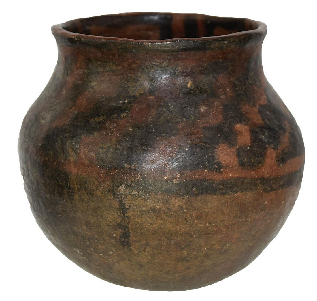 6" H. Jeddito Jar. NM. Dark orange finish with black: 6" H. Jeddito Jar. NM. Dark orange finish with black paint patterns. Paint inside rim. Minor repair to rim. Ex-Gilbert Cooper, Bob Converse