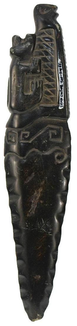 11" Stone Jaguar Effigy Dagger. Pre-Columbian. Peru.: 11" Stone Jaguar Effigy Dagger. Pre-Columbian. Peru. Dark, highly polished form of Jadeite. Heavily engraved. Slight worn tip ding. Very good condition. Pictured in WW#11, p118