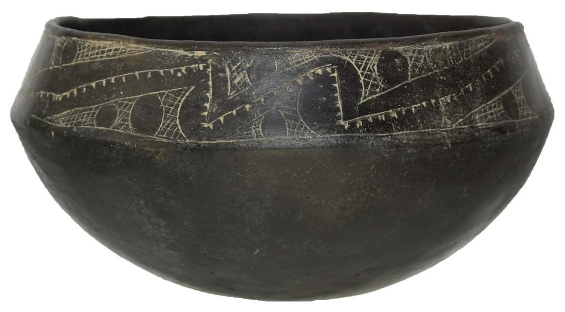 6 3/8" D. Engraved Caddo Bowl. Ex-Ken Partain. AR.: 6 3/8" D. Engraved Caddo Bowl. AR. Carinated rim with engraving. Fine finish, wafer thin. May have hole repair, otherwise appears solid. Ex-Ken Partain