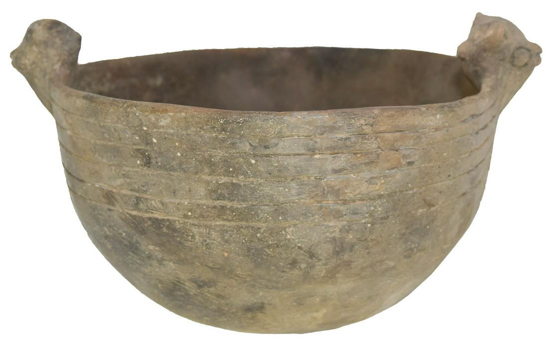 11 1/2" D. Rim Effigy Bowl. Montgomery Co, AR. Davis: 11 1/2" D. Rim Effigy Bowl. Montgomery Co, AR. 2 Rim Effigies with faces on both sides. Restored, one effigy head is original. Davis COA