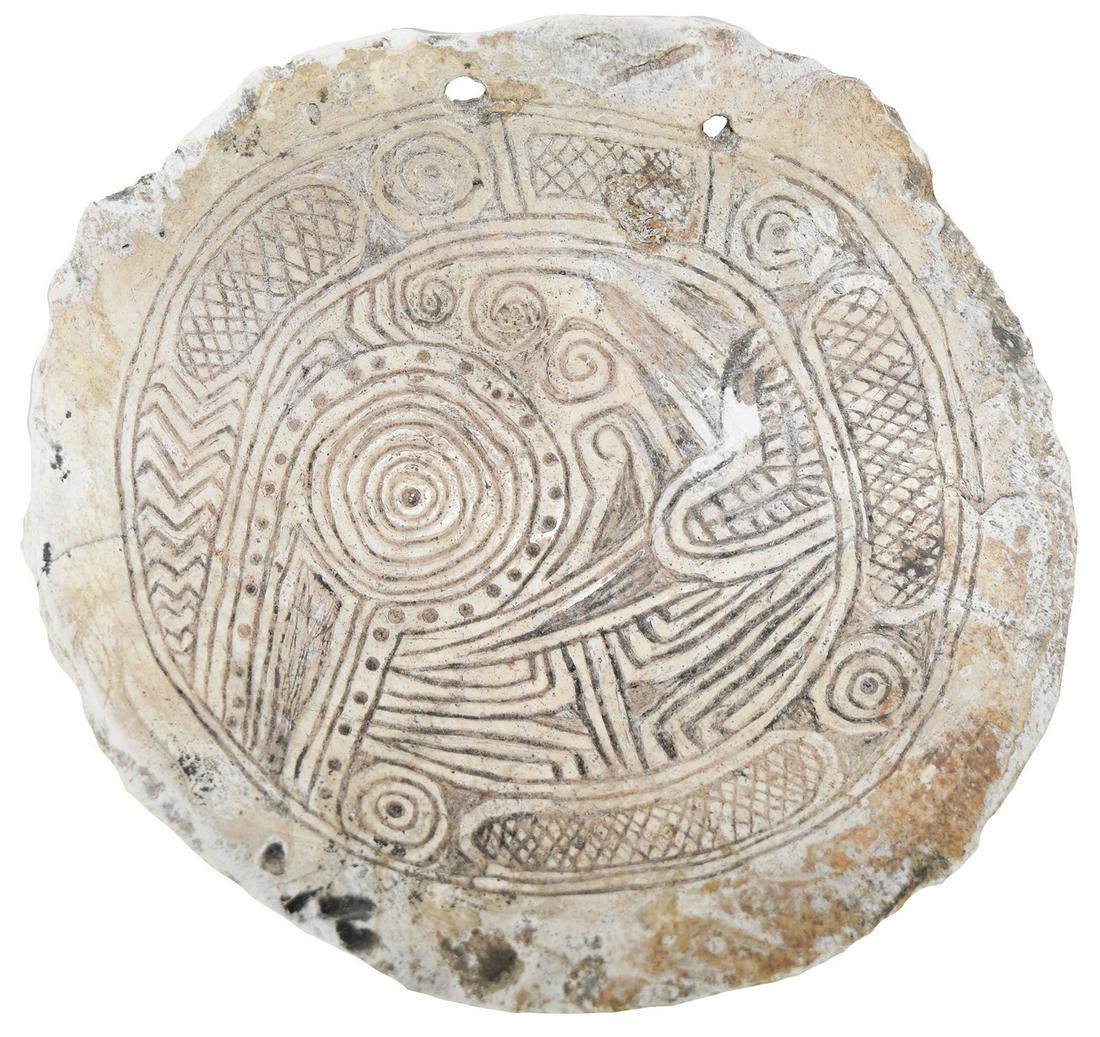 5 1/2" Rattlesnake Shell Gorget. Pictured in WW#4.: 5 1/2" Rattlesnake Shell Gorget. Anderson Co, TN. Rare Citico Type. Fine condition. Ex-Kevin Pipes, Hal Noe. Pictured in WW#4 , p232 and in Pipes April 2012 Sale Catalog. Rare offering. A featured ite