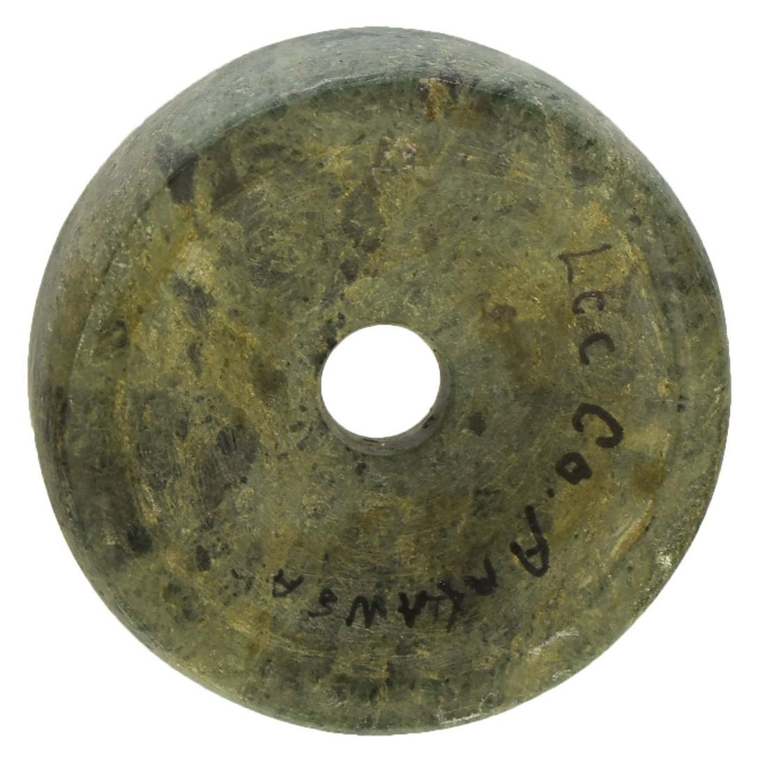 1 13/16" Perforated Gamestone Discoidal. Lee Co, AR.: 1 13/16" Perforated Gamestone Discoidal. Lee Co, AR. Form of Greenstone. Very well made, fine condition. Very good symmetry