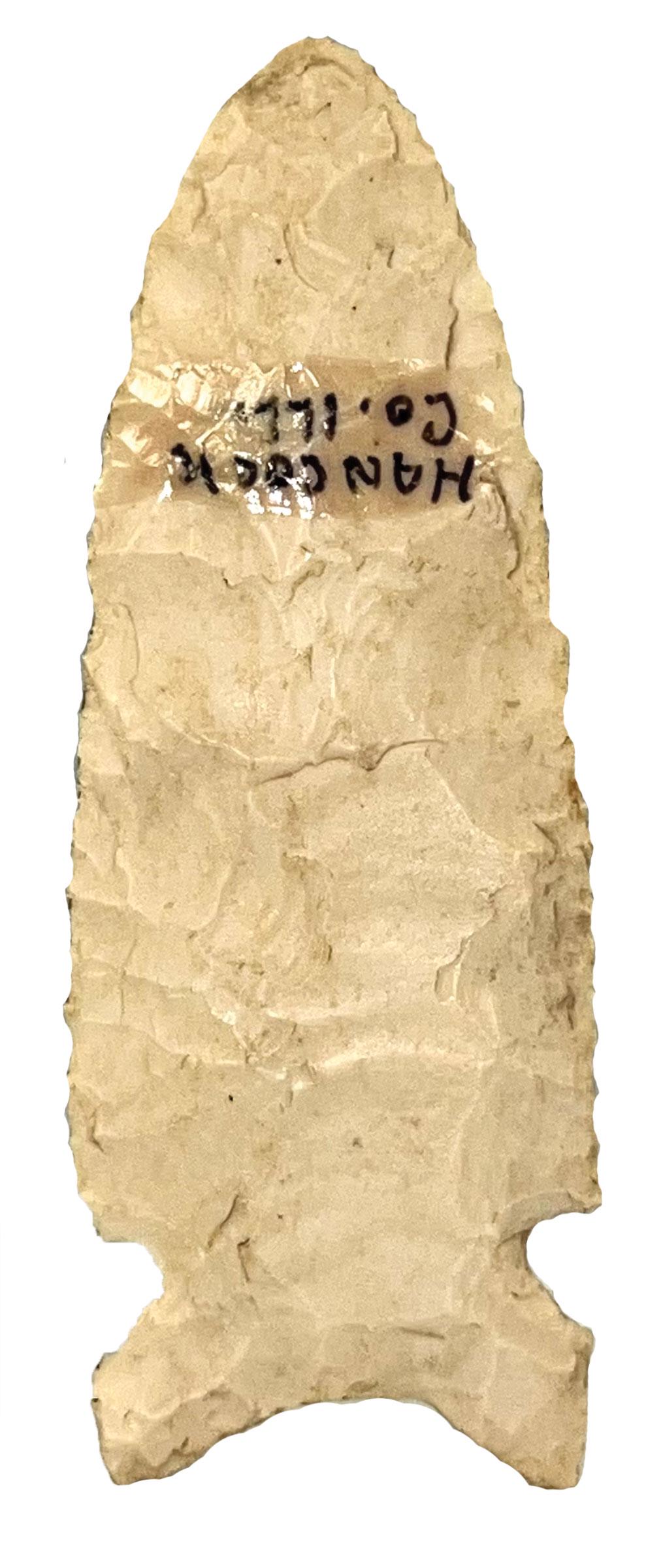2 7/8" Graham Cave. IL. Anciently crafted from a fluted Clovis. Ex-Beutell: 2 7/8" Graham Cave. Hancock Co, IL. Neat point anciently crafted from a fluted Clovis. Fine condition. Ex-Dean Mesnard, Mitch Lewis, Tommy Beutell. Granger COA