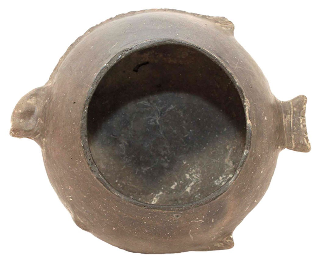 6 1/2" Fish Effigy Bowl. Pictured. Partain Paper: 6 1/2" Fish Effigy Bowl. Mississippi Co, AR. Appears solid. Pictured in Partain Relics. One of the more graceful and developed Effigy Fish Bowls we've auctioned. Partain Paper