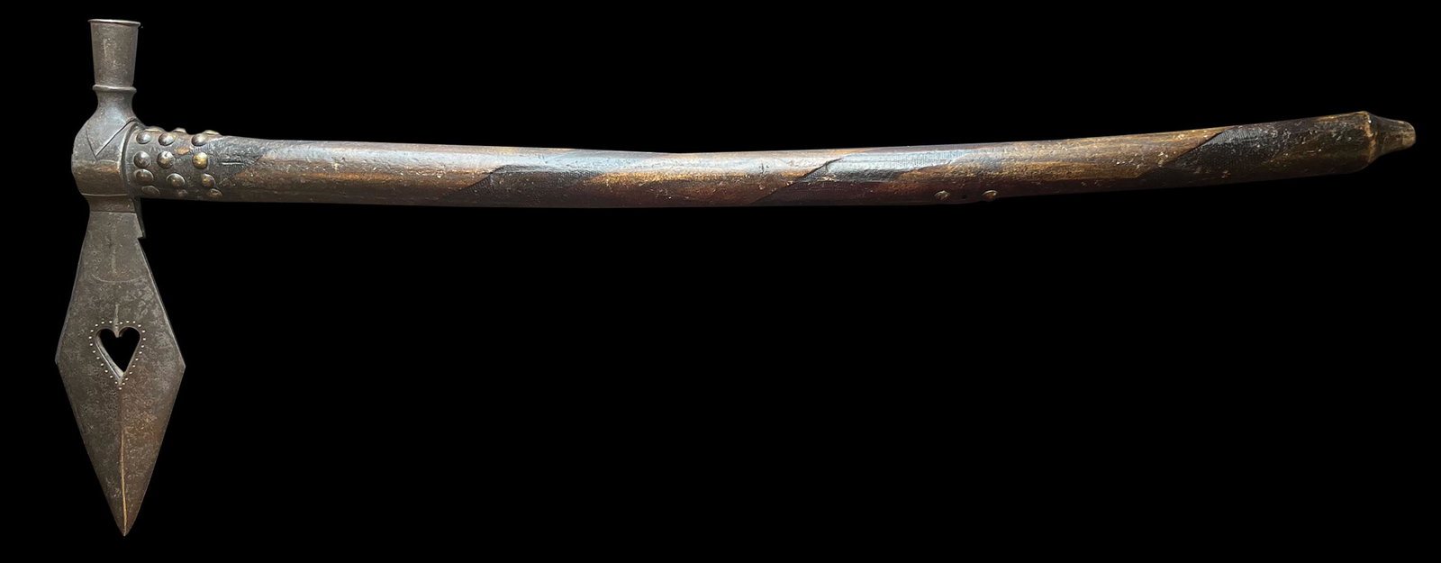 25 1/2" Tomahawk Pipe. Elaborate Wood Handle. Decorated with 28 metal tacks.: 25 1/2" Tomahawk Pipe. Elaborate Wood Handle with a rasped design encircling the entre length. Decorated with 28 metal tacks. Hand forged head with decorated heart cutout. Haft tight. Historic 1880 to