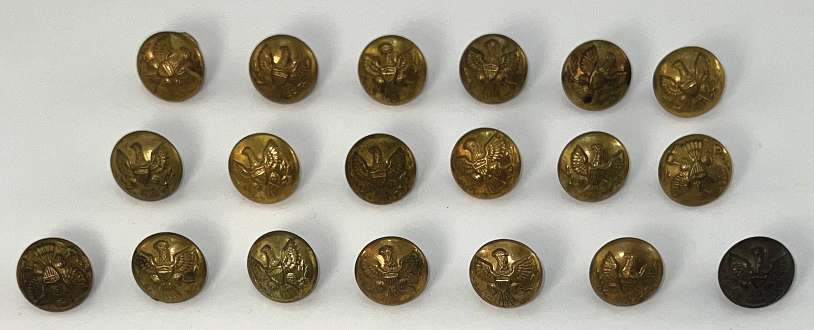 19 Gold Colored Eagle Buttons from the Indian Wars (circa 1870- 1890). (1 of 2)