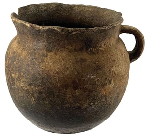 5 1/4” T. Strap Handle Pottery Jar. Ground up quartz or mica temper. Ex Jeff Hunt.
