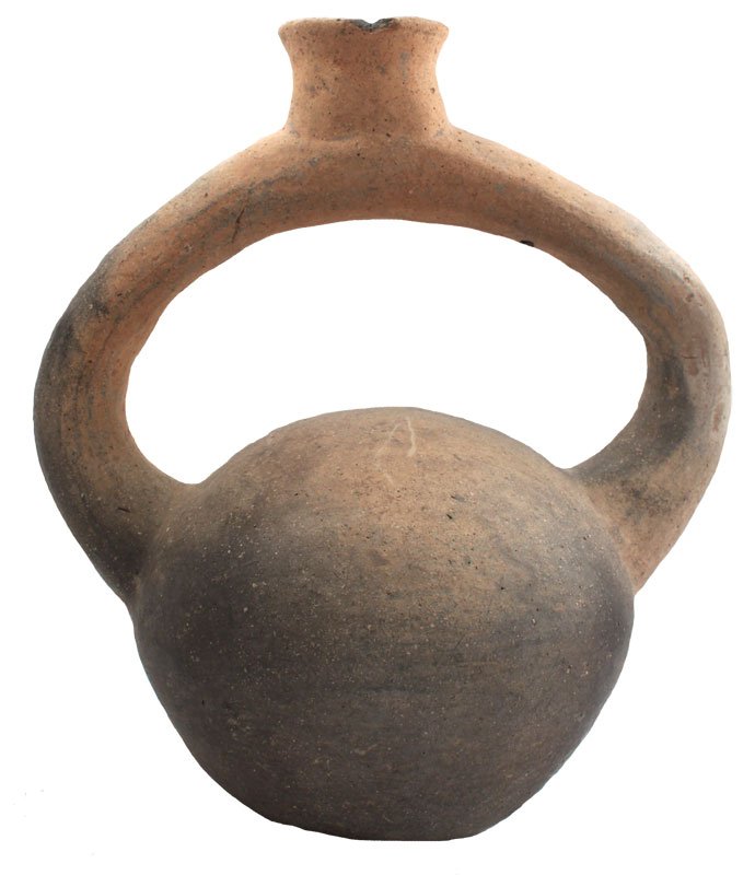9 1/4" Stirrup Bottle. Well pictured. Hathcock: 9 1/4" Stirrup Bottle. Lee Co, AR. Pictured in The Quapaw and their Pottery (p72, fig 108), Prehistoric Art (1980 #1, p31). Appears solid, one of the best. Ex-John Grotte. Hathcock