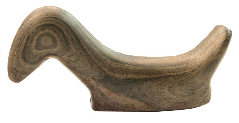 3 1/4" Slate Birdstone. Spencer, OH: 3 1/4" Slate Birdstone. Spencer, OH. Banding forms "eye". Very good condition, small nick to tail. Ex-Albert Broadsword. Can be seen on Earl's shelf in Legends of Prehistoric Art II (p130)