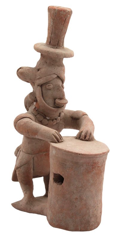 5 3/4" H. Clay Figure playing drum. Glued. Western: 5 3/4" H. Clay Figure playing drum. Glued. Western Mexico. Detailed Applique features. Riddick PreColumbian Collection