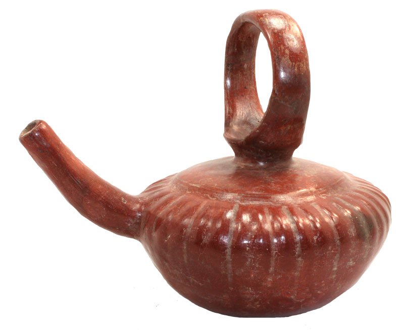 9" Finely-modeled loop-handled Florero; fluted redware: 9" Finely-modeled loop-handled Florero; fluted redware with long tubular loop spout on one side. Burnished surface. Tzintzuntzan. Michoacan. 200 B.C to 1500 A.D. 1986 Dockstader Appraisal. PreColumbia