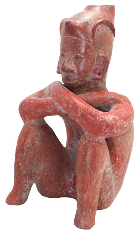 10 1/4" Fine burnished redware anthropomorphic Seated: 10 1/4" Fine burnished redware anthropomorphic Seated Jorobado Figure; leaning forward on knees. Flat base, pointed cap, incised details. Surface worn. Colima, MX. 250 BC to 250 AD. . 1986 Dockstader