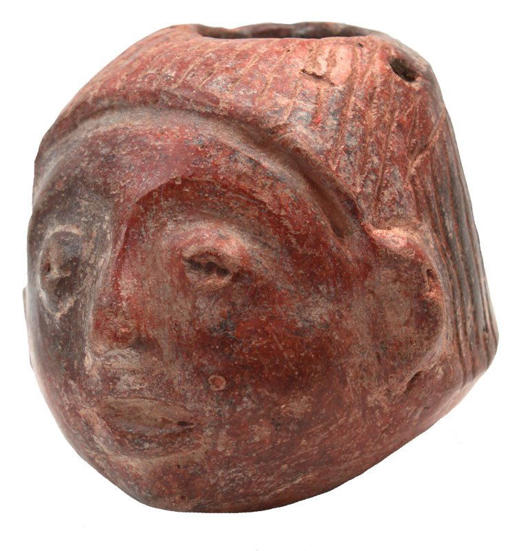2 1/8" H. Miniature Human Head Pot. Well modeled,: 2 1/8" H. Miniature Human Head Pot. Well modeled, incised. Rare. A copy of Dr. Frederick Dockstader's 1986 Appraisal accompanies this piece. Colima. PreColumbian. Mexico. 500 BC to 500 AD