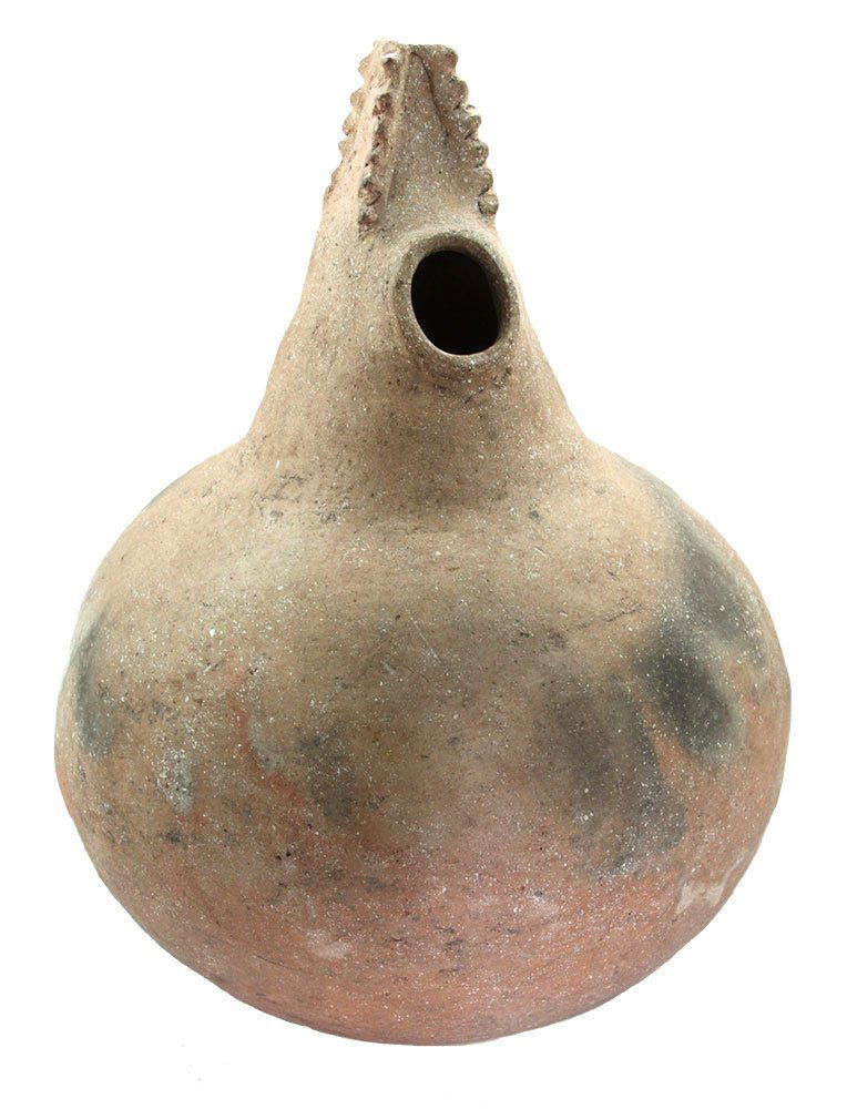 10" H. Corngod Effigy Bottle. Soudan Site. Pictured: 10" H. Corngod Effigy Bottle. Soudan Site. Lee Co, AR. One of the finest of its type. Large, buff color. Solid, excellent condition. Ex-Rick Fitzgerald, E.W. Brown. Pictured in Hathcock's Ancient Indi