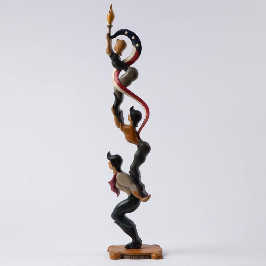 A 20TH CENTURY PATRIOTIC AMERICANA FIGURAL CARVING: Contemporary example of American folk art carving by Kansas artists Rhett, Shadran, and Travis Johnson, dated 1988. Single board figural wood sculpture of three men, standing vertically, carrying a bu