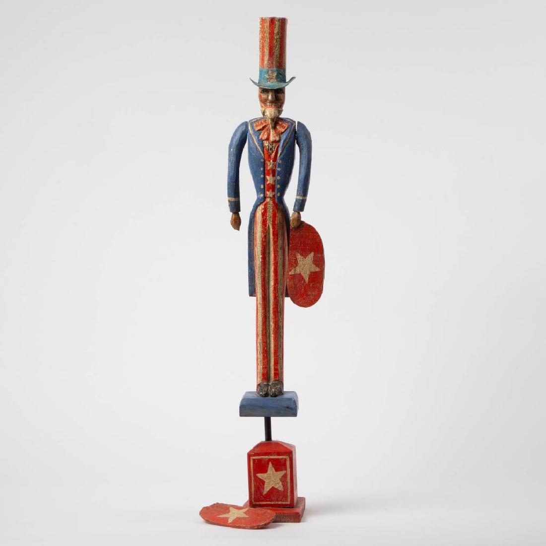 MODERN FOLK ART UNCLE SAM WHIRLIGIG, 20TH C: A contemporary, handmade replica of the popular Uncle Sam whirligig prevalently made in the early 20th century. Details are exaggerated amateur carving, modeling, and painting. Patina has been highly 