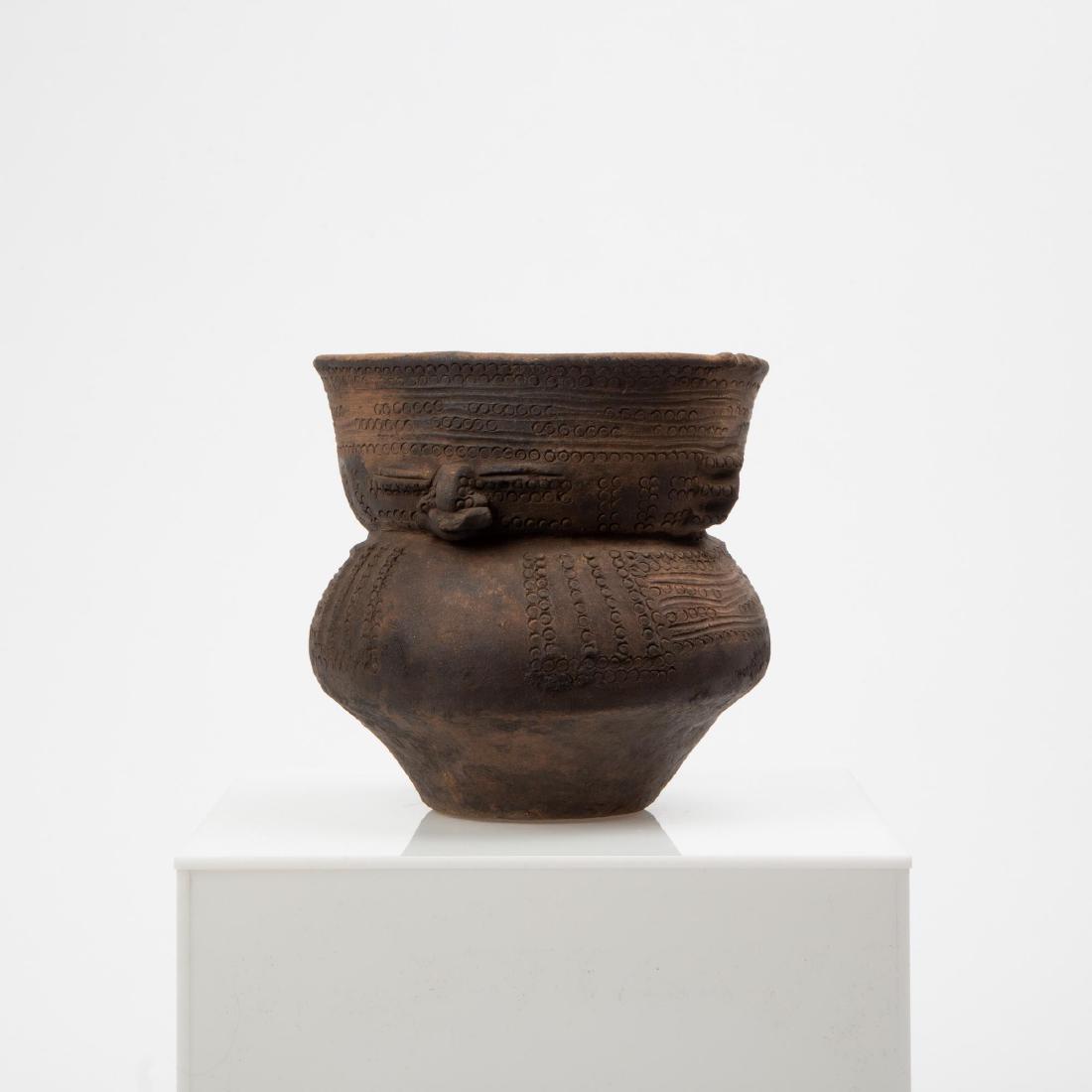 A PRE-COLUMBIAN QUIMBAYA POTTERY VESSEL WITH FACES (1 of 10)