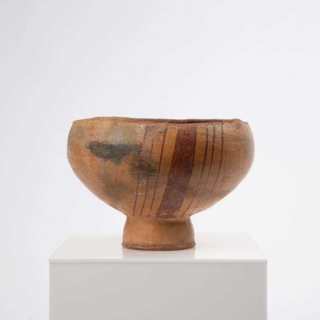 A PRE-COLUMBIAN MUISCA TALL PEDESTAL BOWL: Pre-Columbian Muisca (Muysca) culture (Colombia, 1200-1500 CE). Pedestal bowl with red pigment on cream ground. Measures 6.25 x 9.5 inches. Lot includes a smaller MuiscaÂ pedestal bowl, 3.5 x 5.5 in