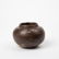 A TAIRONA INCISED BLACKWARE VESSEL WITH WHITE