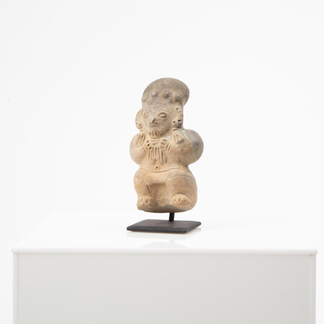 A PRE-COLUMBIAN DEITY EFFIGY FIGURE DEVOURING CHILD (1 of 10)