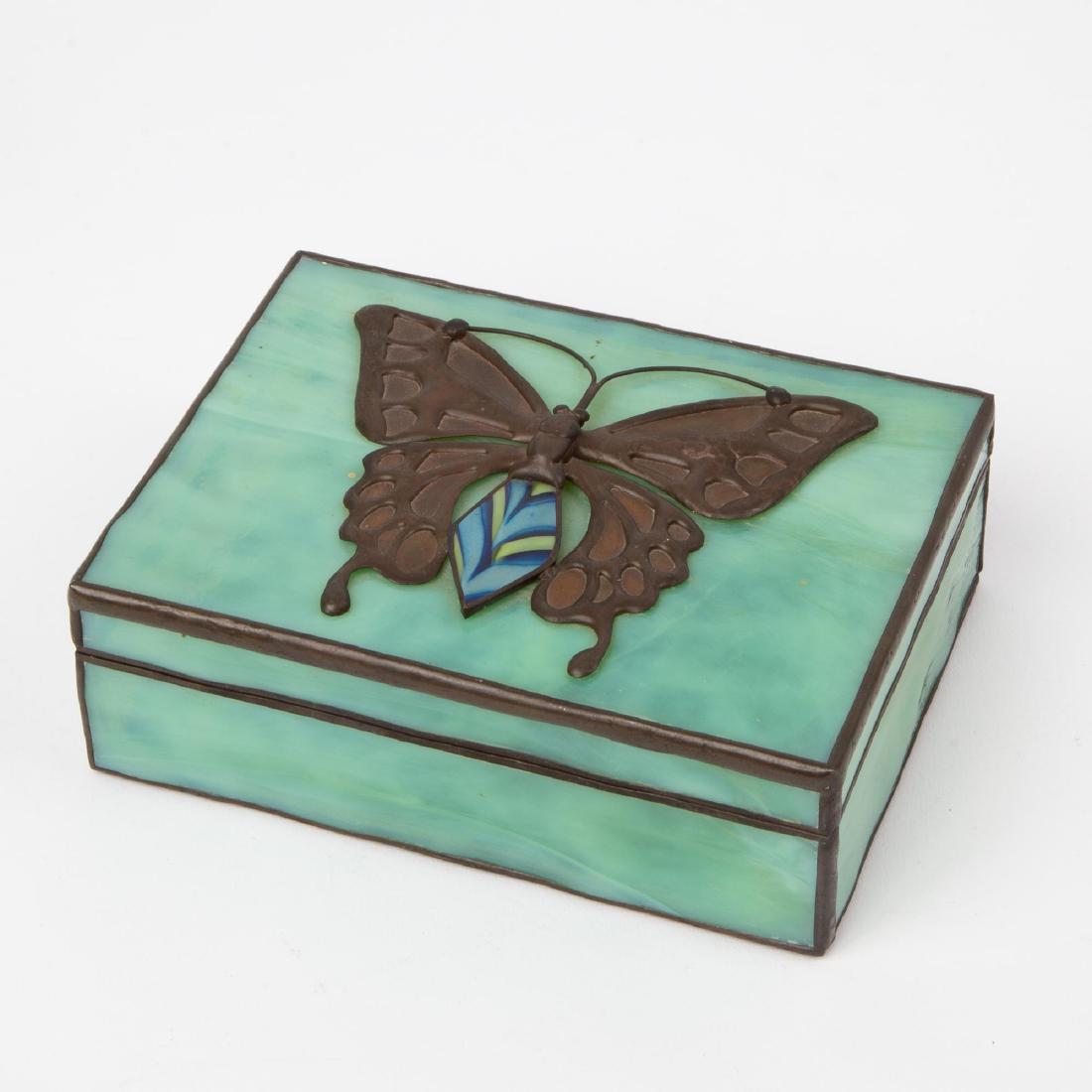 ORIENT & FLUME ART GLASS BUTTERFLY BOX: A 1977 Orient & Flume art glass box affixed with a metal and iridescent glass butterfly design. Numbered 131 of an edition of 200. Marked on the inside lip of the lid "Orient & Flume B1977OÂ 131/200