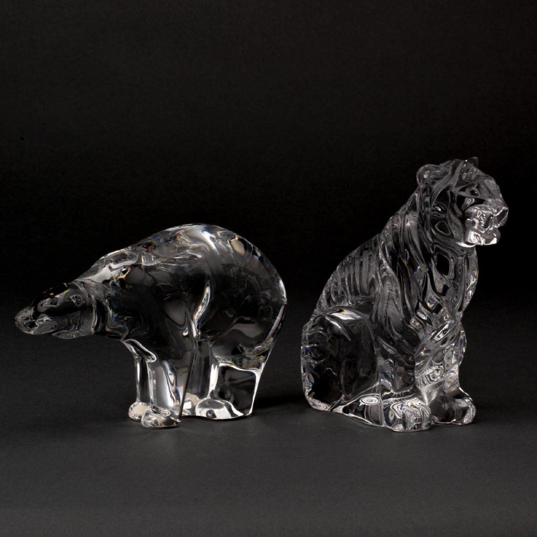 BACCARAT CRYSTAL TIGER AND POLAR BEAR: A Baccarat crystal tiger (5.5 x 4.75 x 3 inches) and polar bear (4 x 6.5 x 2.25 inches). Each acid-etched with logo on base.Â