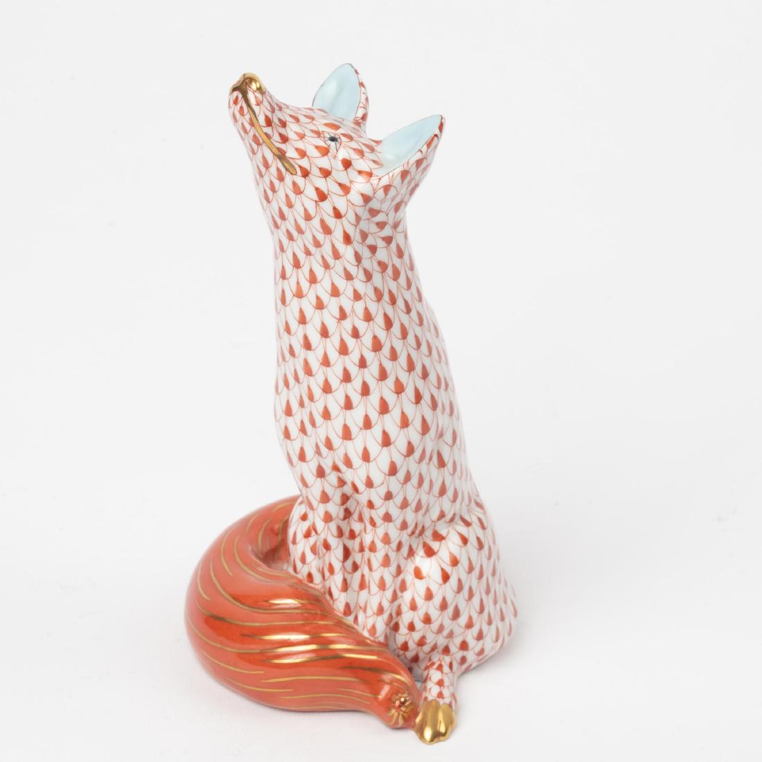 HEREND HAND-PAINTED PORCELAIN FOX: A HerendÂ Hungary hand-painted and gilt porcelain fox, with rust fishnet pattern. HerendÂ mark on the base. 6.5 inch height.