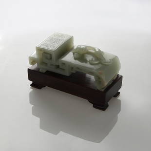 CHINESE CELADON NEPHRITE JADE SCHOLARS INK REST,: Carved celadon nephrite ink rest, or ink bed, with stand. Decorated with a relief dragon and incised floral pattern. As an object for scholarly use, it furnishes the desk of a gentleman. Measures 3 1/