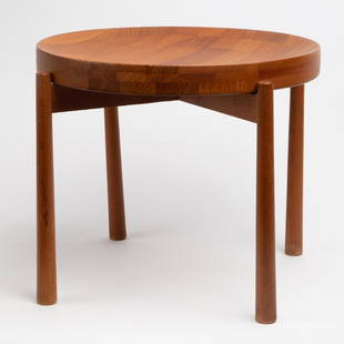 Jens Quistgaard Teak Tray Table: A Jens Quistgaard designed teak table, with a butcher block tray top. The tray is shaped in the form of a shallow bowl, or may be flipped over for a flat surface. Unsigned. Remnants of a "Made In