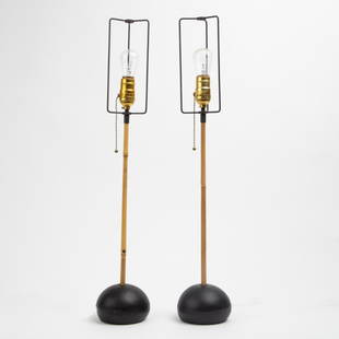 Pair of Noguchi Akari Bamboo Table Lamps: A vintage pair of Isamu Noguchi for Akari table lamps, bamboo shafts on cast iron bases. Each signed "MADE IN JAPAN" (cast onto the underside). No shades. Each 26 inches high.