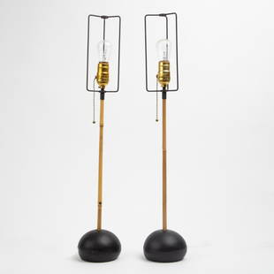 Pair of Noguchi Akari Bamboo Table Lamps: A vintage pair of Isamu Noguchi for Akari table lamps, bamboo shafts on cast iron bases. Each signed "MADE IN JAPAN" (cast onto the underside). No shades. Each 26 inches high.