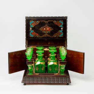19th c. French Tantalus, U.S. Ambassador's Collection: A 19th century tantalus set by the Schucht Brothers of Besancon, France, consisting of an ebonized locking boulle casket with four Moser-style