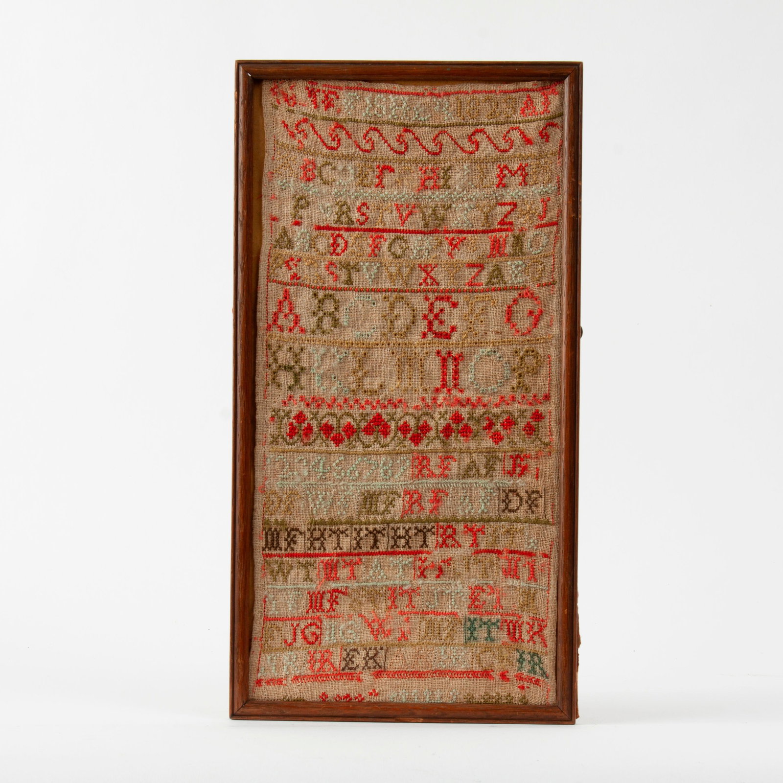 1823 Alphabet Sampler, Signed Fisher: An 1823 alphabet sampler by a young Ms. Fisher, with some floral detailing. In a wooden frame that measures 17" x 9".