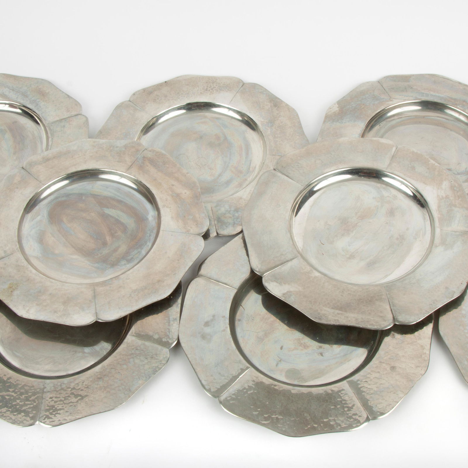 Porter Blanchard (1886-1973) Arts & Crafts Chargers: Porter George Blanchard (American, 1886-1973) A set of eight pewter chargers with hand-hammered lobes, circa 1960s. Each is stamped "197 HANDMADE PORTER BLANCHARD" to the underside. Blanchar