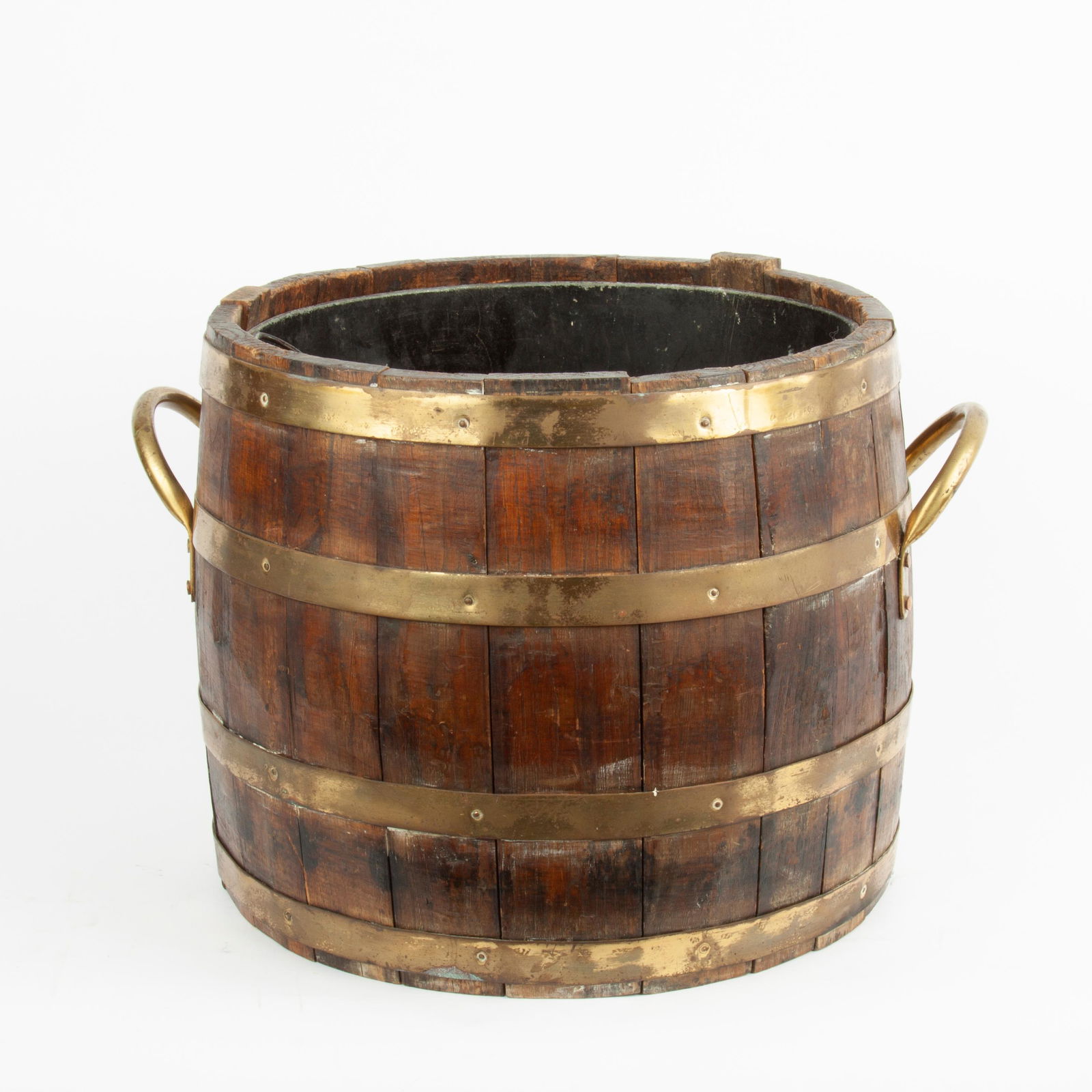 19th c. English Oak Barrel with Brass Bands and Liner: A late Victorian English oak barrel, with four brass bands and two brass handles. Inside is a removable lead liner. Barrel is 13" x 15" (19" across including handles).