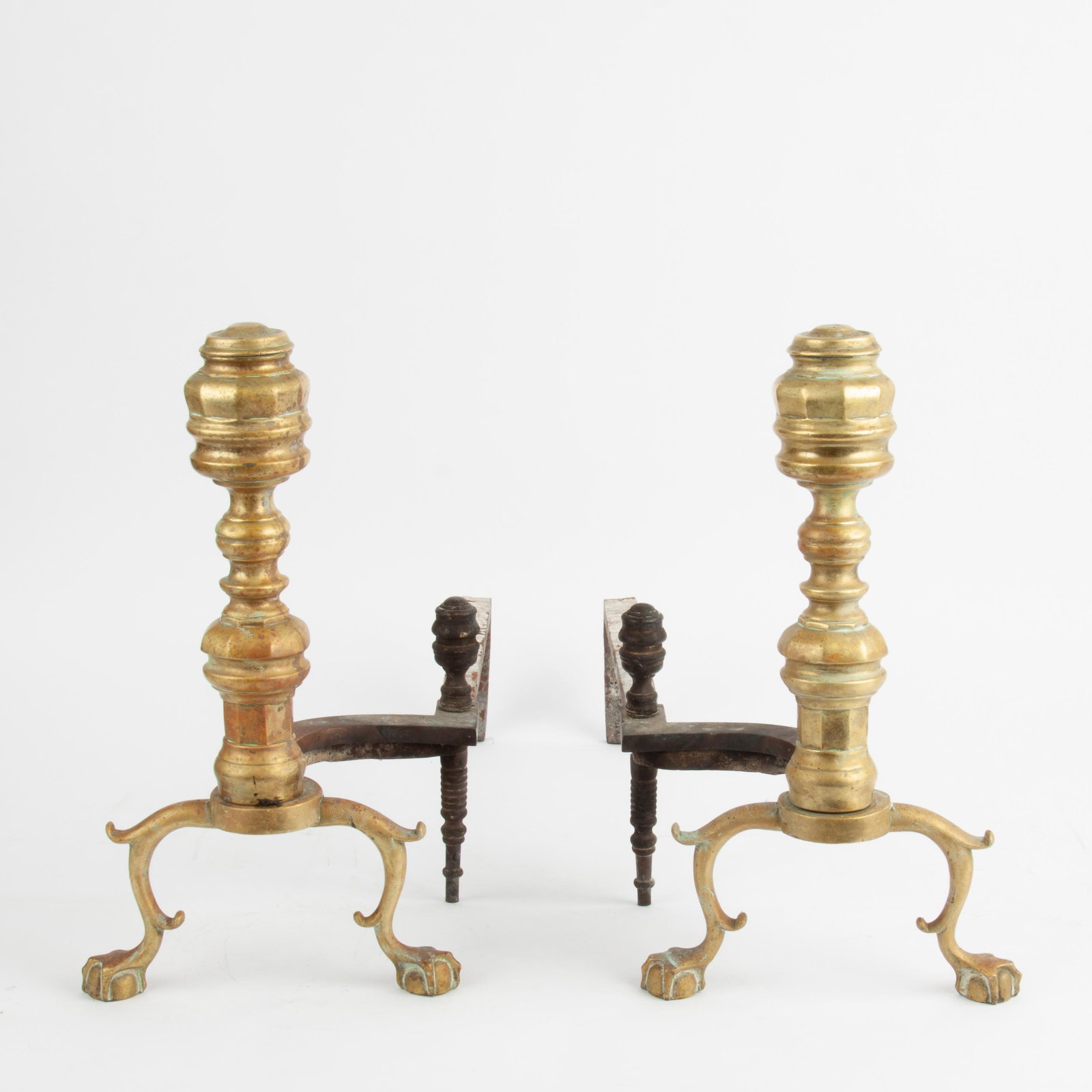 Chippendale Period Brass Andirons, 19th c. Brass Fender: A pair of Chippendale period (18th century) brass andirons with claw and ball feet. Each andiron measures approximately 18" x 26" x 10 1/2". Offered alongside a brass fireplace fender circa 1840, whic