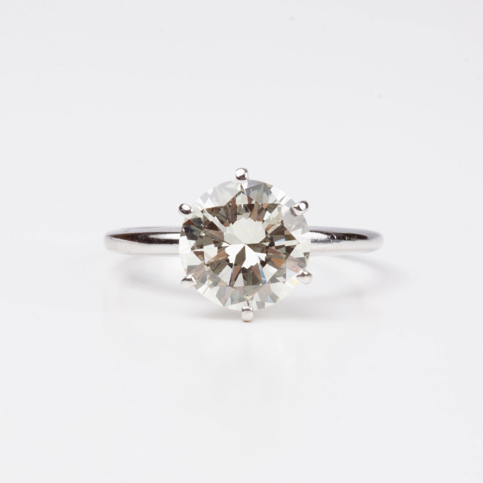 14k Solitaire Diamond 2.92 Carat Ring, White Gold: 14k white gold solitaire diamond ring. With a round brilliant 2.92 carat diamond in 6 prongs with VS2 clarity, M color, good symmetry, good polish, and no florescence. The ring is marked on the interi