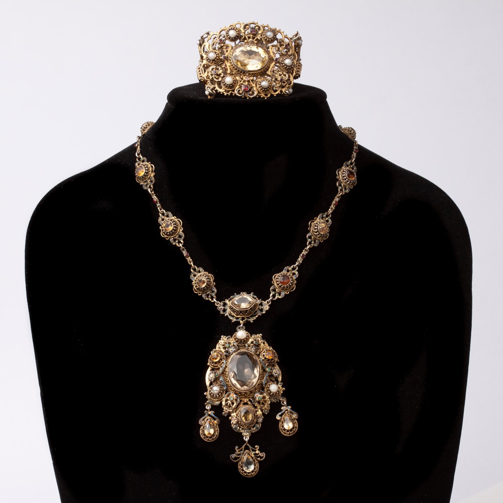 Austro Hungarian Demi Parure, Citrine, Emerald, Pearl: Austro Hungarian Renaissance Revival style, demi-parure necklace and bracelet set, gold washed 800 silver with precious and semi precious gemstones. All the stones are bezel set wi