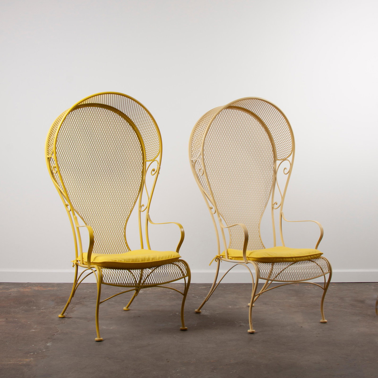 1960s Woodard Canopy Chairs, Pair: A pair of Woodard steel balloon-back canopy chairs, lemon paint finish, circa 1960s. Each measures approximately 56" x 28 1/2" x 30".