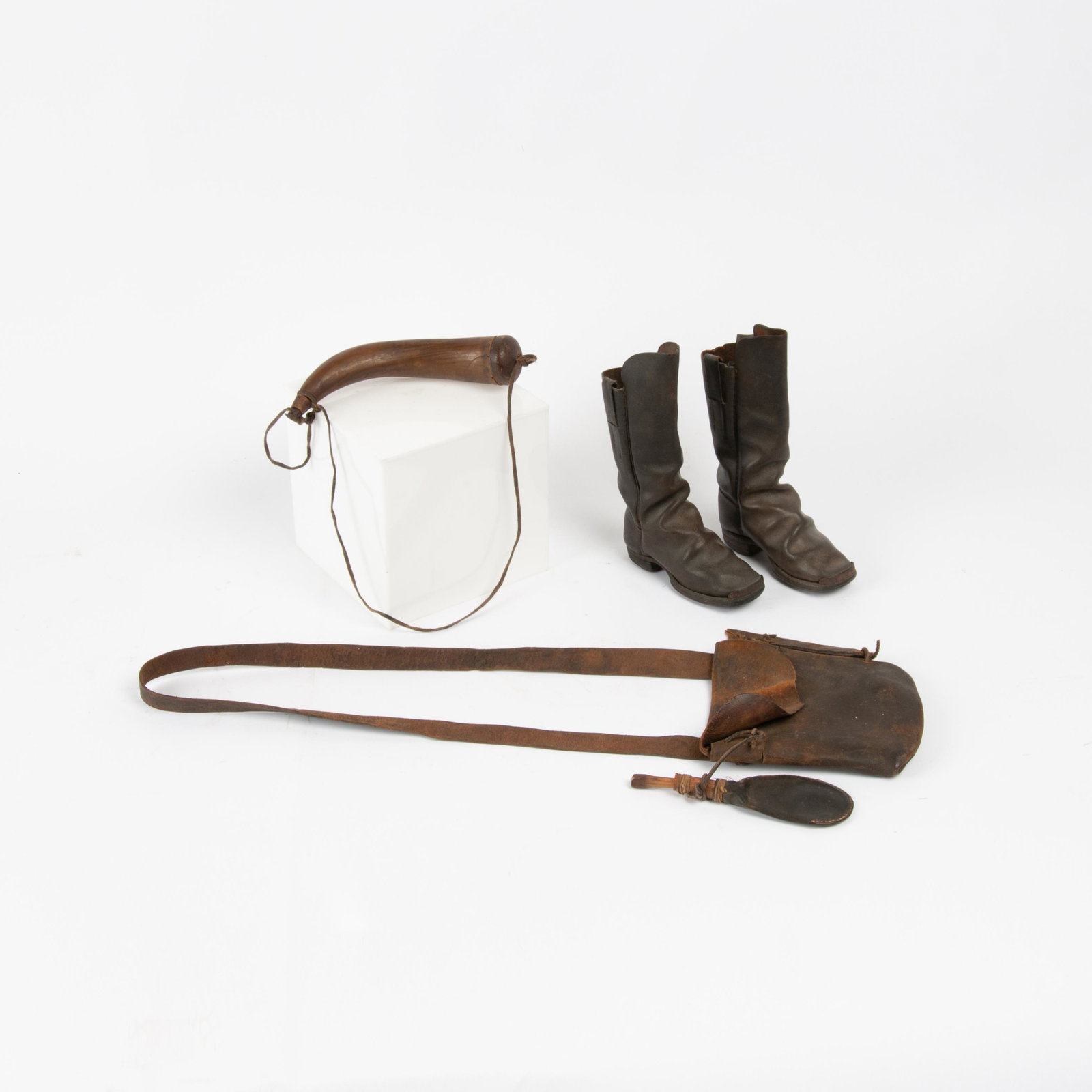 Early Child's Leather Boots, Necessary Bag, and Powder: Lot of antique items with leather. Includes a pair of very early child's boots with iron toe, A handmade necessary pouch with shot bag and knife sheath, and a powder horn with leather strap.