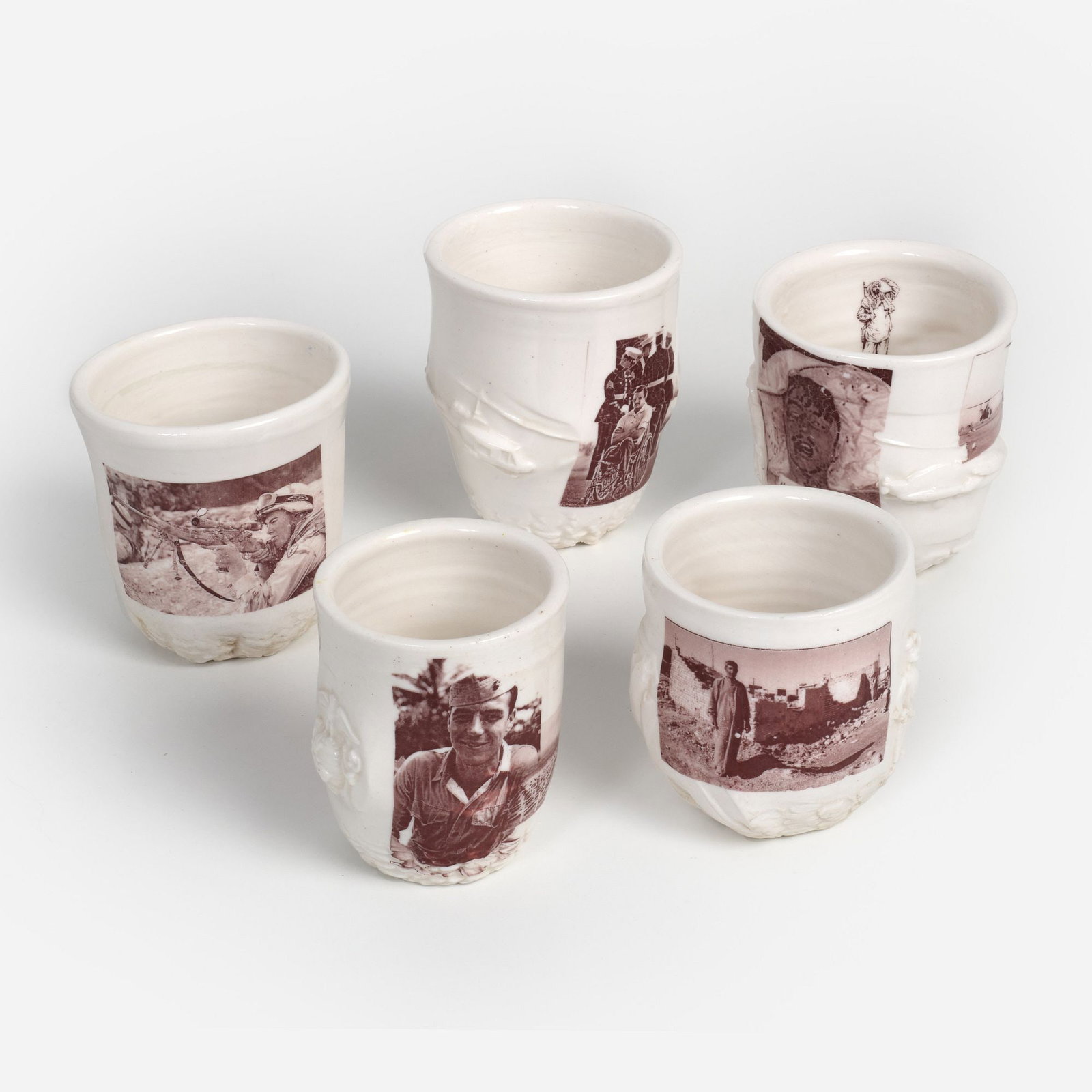 Ehren Tool, Five Cups (ca. 2005-07): Ehren Tool (California, b. 1970) Five cups, circa 2005-2007 Glazed and transfer-printed stoneware Approximately 3 1/2" x 3" apiece Each is signed and dated to the underside (som